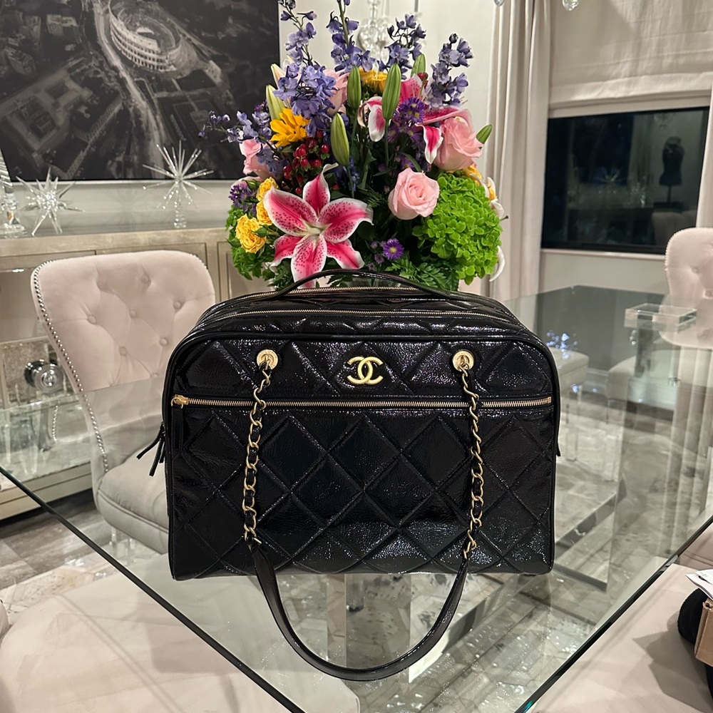 Chanel Black Quilted luggage with Gold Accents